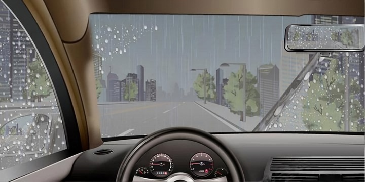 如图所示，驾驶汽车在雨天起步前要使用刮水器。配图